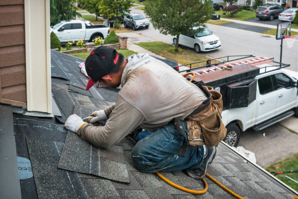 Professional Roof Replacement technician working in Claiborne, MD